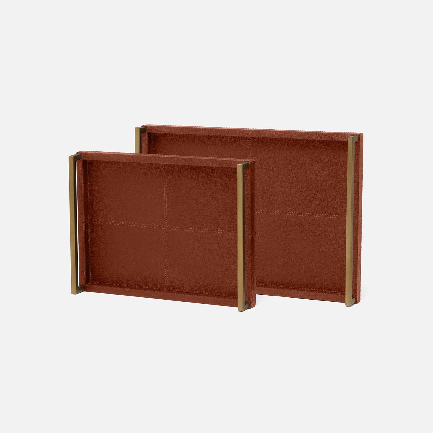 Two brown leather trays with gold edges on a white background