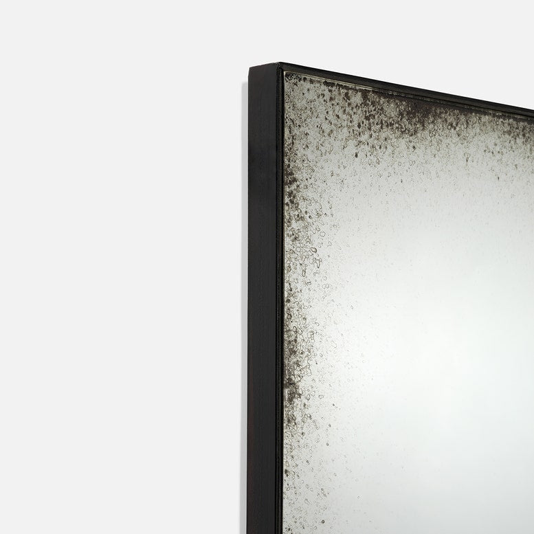 Rectangular mirror with a black frame on a white background