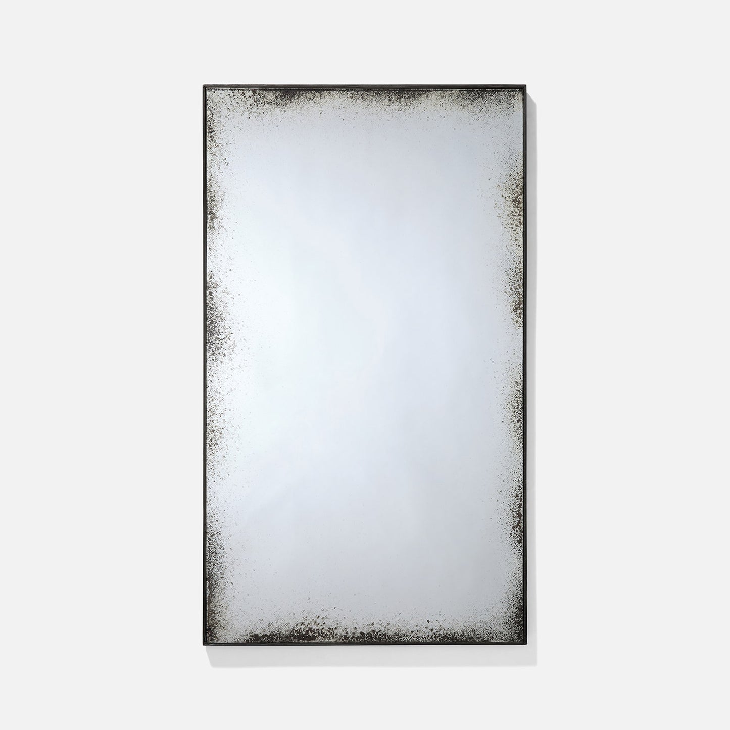 Rectangular mirror with a textured black frame on a white background