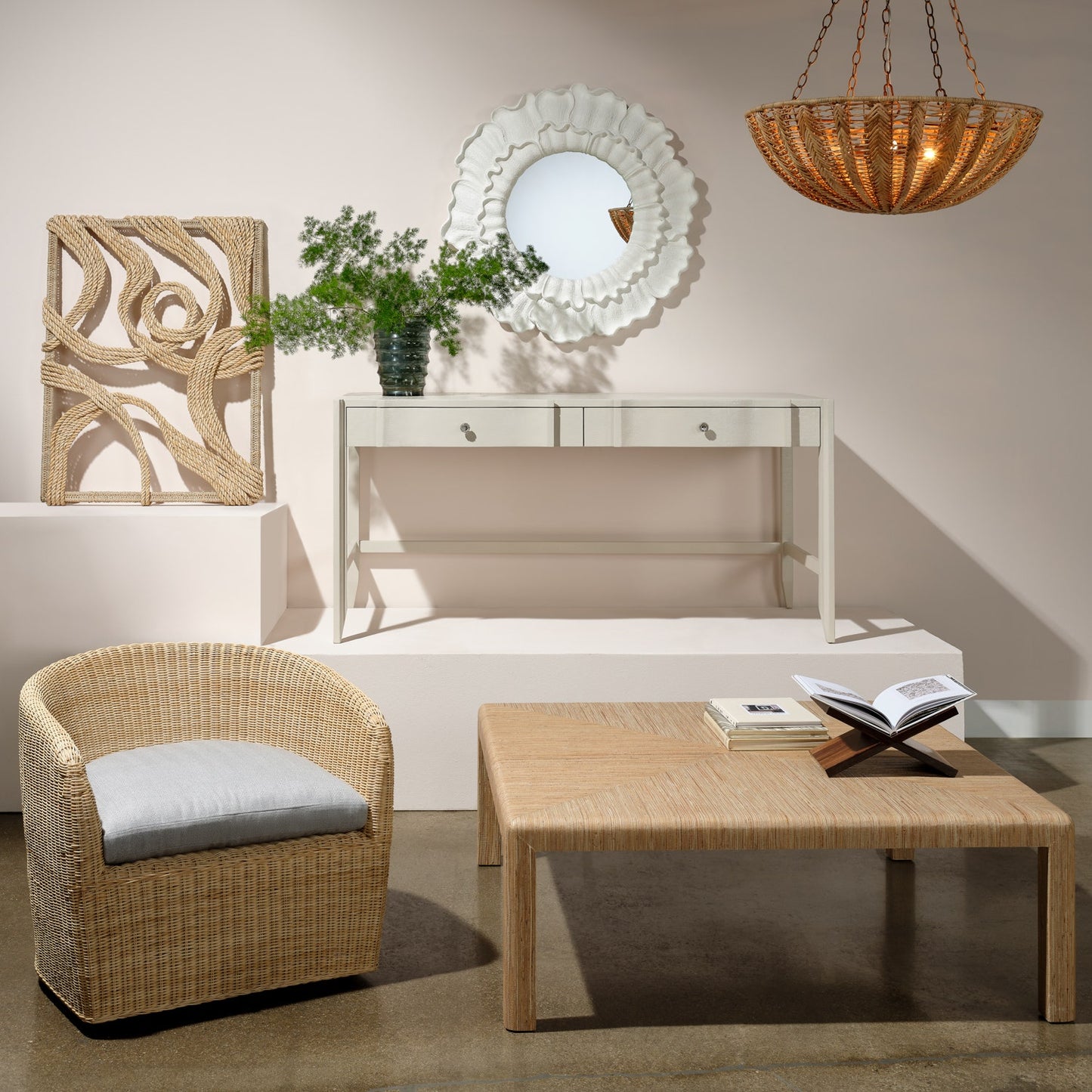 Modern interior with wicker chair, table, and decorative elements.