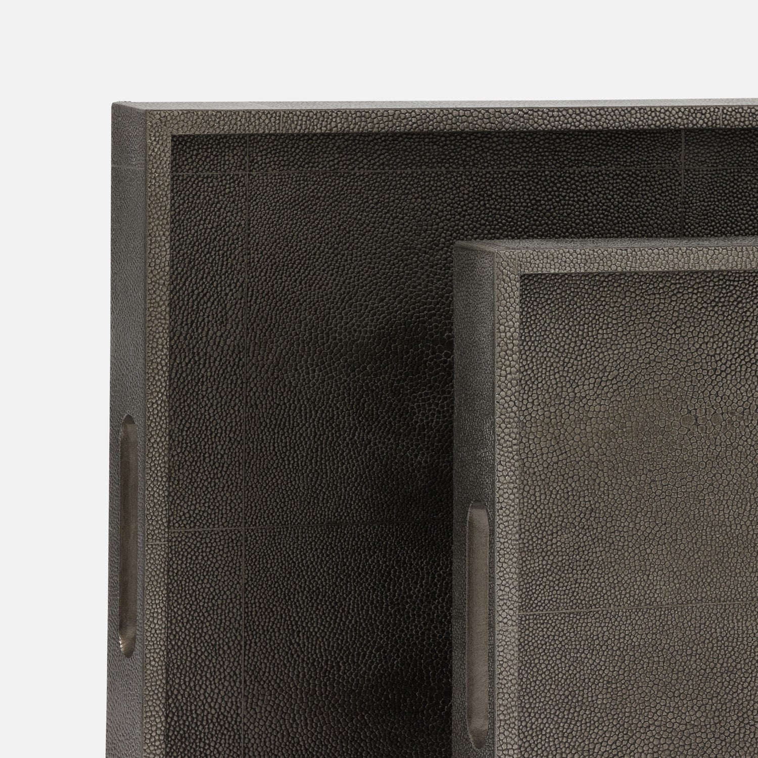 Two dark brown leather trays with a textured surface on a white background