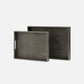 Two dark gray trays with handles on a white background