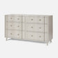 Light gray dresser with multiple drawers on a white background