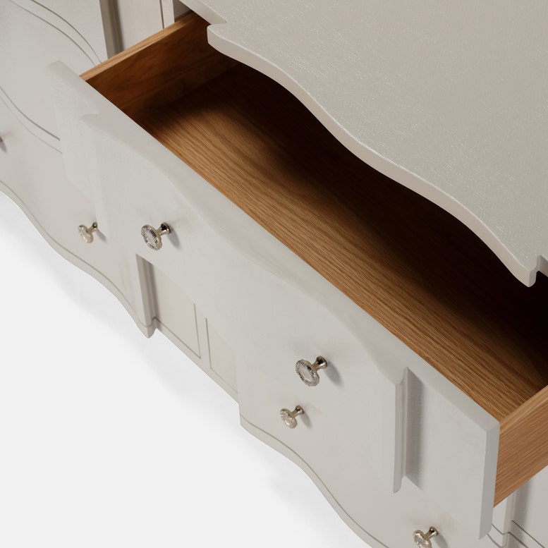 Close-up of a wooden drawer with a light gray cabinet on a white background