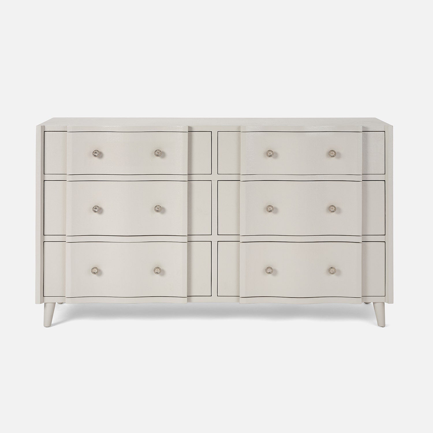White dresser with multiple drawers on a white background