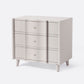 Beige dresser with three drawers on a white background