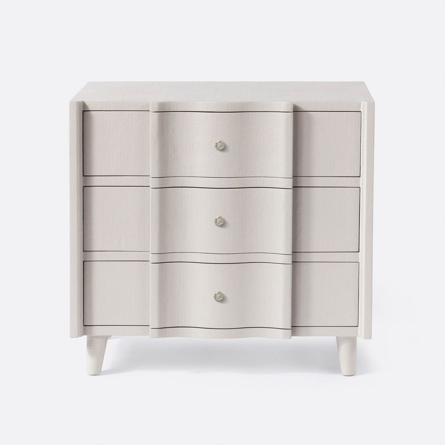 Light gray dresser with three drawers on a white background