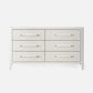 White dresser with gold handles on a white background