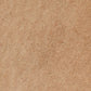 A close-up texture shot of a warm tan or light brown hair-like material, showing fine fibers and subtle tonal variation.