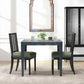 Dining table with two chairs in a room with a mirror and cabinet.