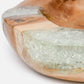 Wooden bowl with embedded crystal-like material on a white background