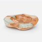Wooden bowl with embedded glass on a white background