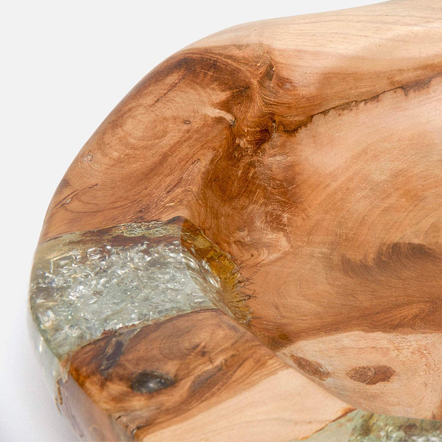 Wooden cutting board with a natural grain pattern and embedded clear resin on a white background