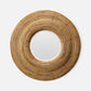 Round mirror with a woven brown frame on a white background