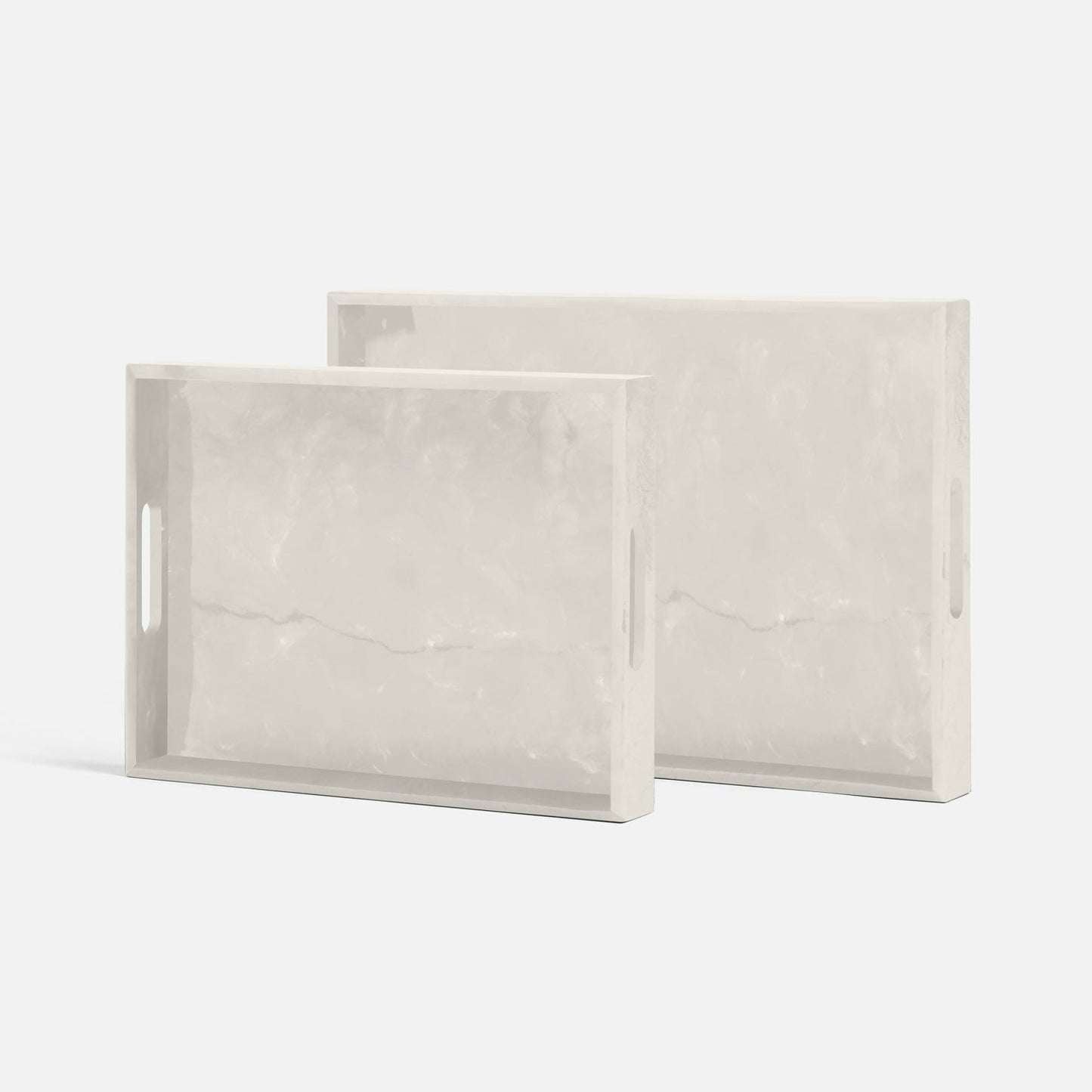 Two rectangular marble-patterned trays on a white background