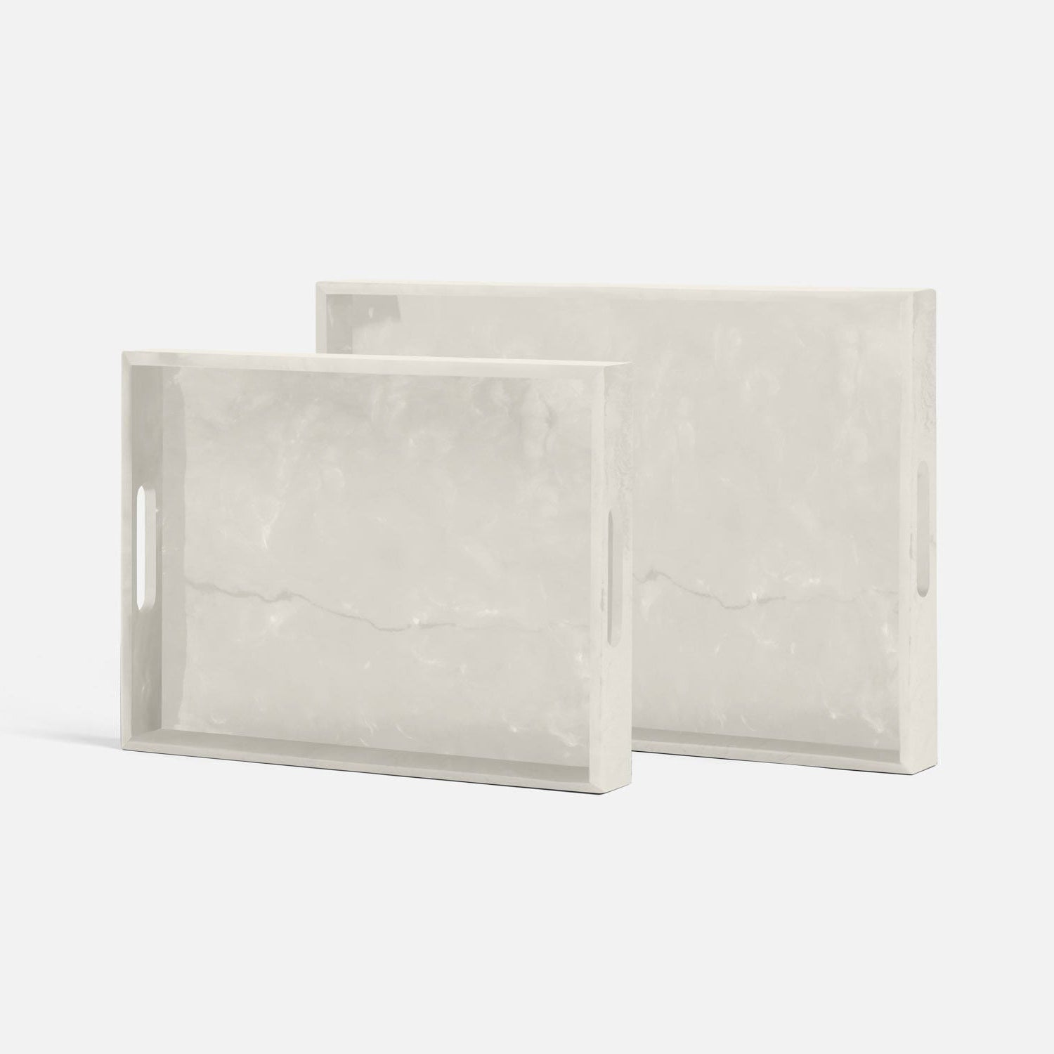 Two rectangular marble-patterned trays on a white background