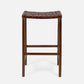Wooden bar stool with woven seat on a white background
