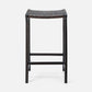 Black woven bar stool on a white background