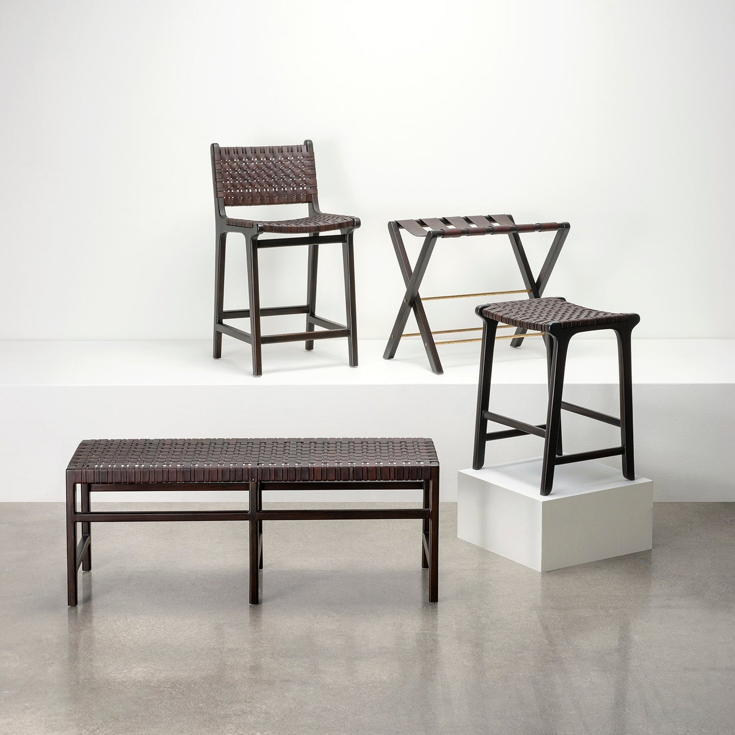 Set of woven stools and a bench on a white background