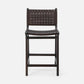 Dark brown woven chair on a white background
