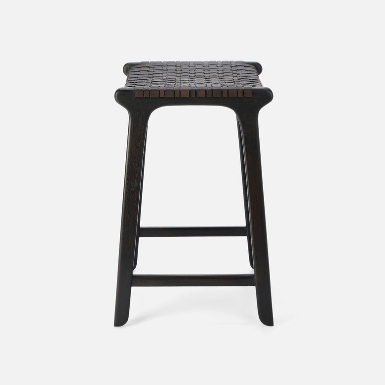 Black woven stool on a white background