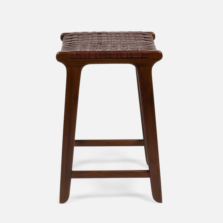 Wooden bar stool with woven seat on a white background
