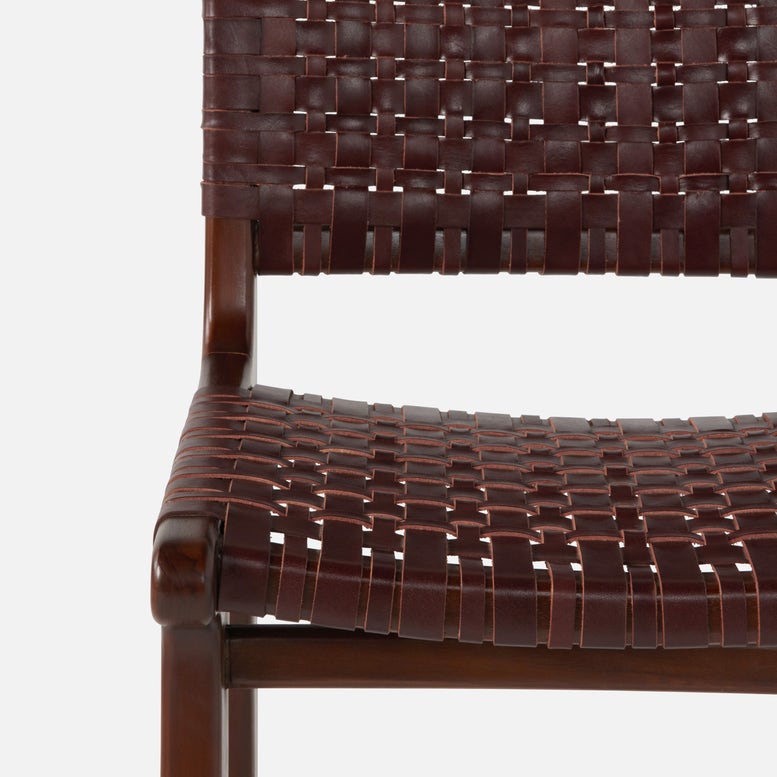 Close-up of a brown woven chair on a white background