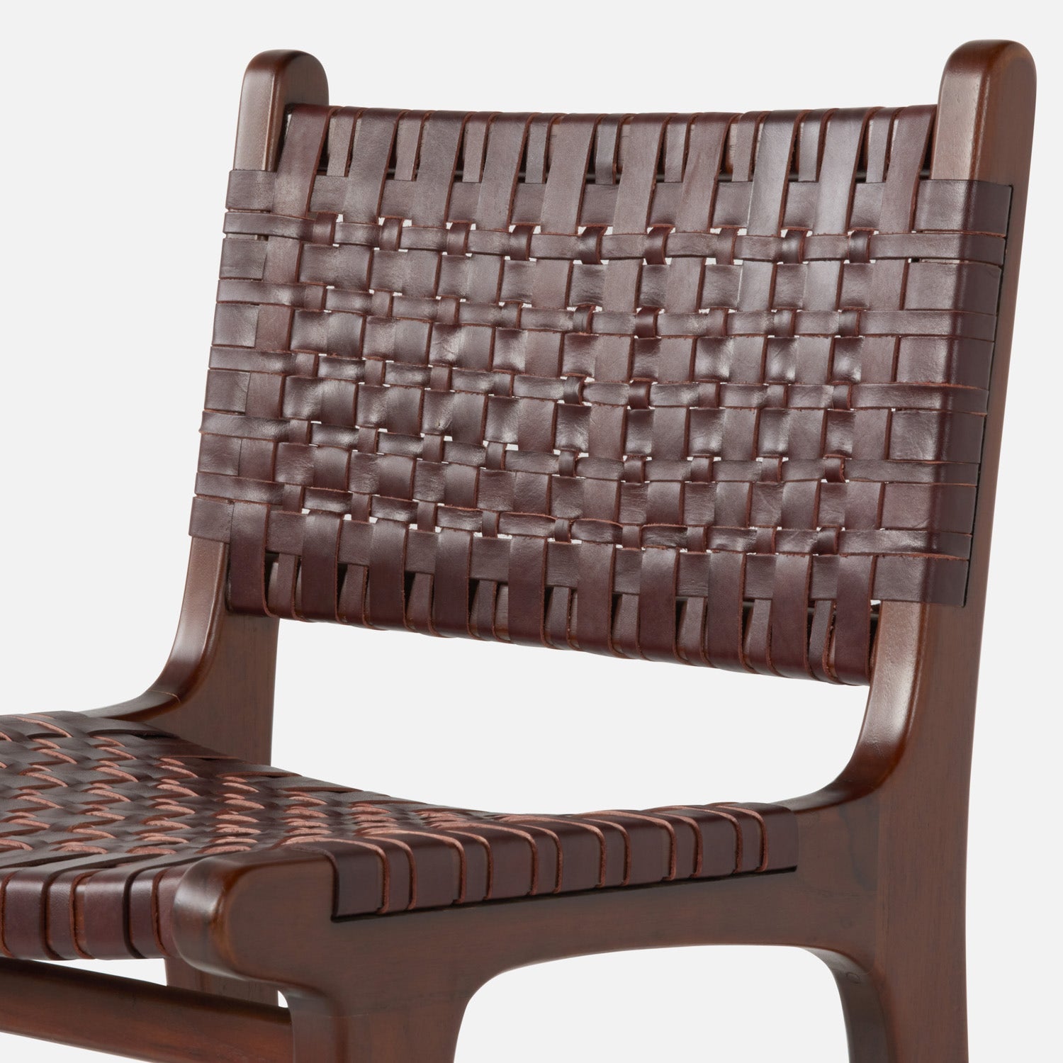 Brown woven chair with a white background