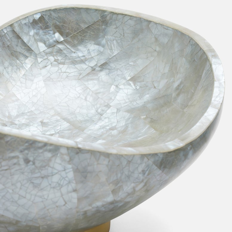 Close-up of a textured stone bowl on a white background