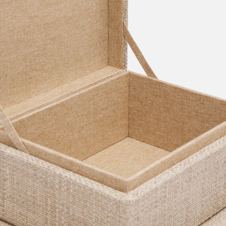 Beige fabric storage box with lid open on a white background