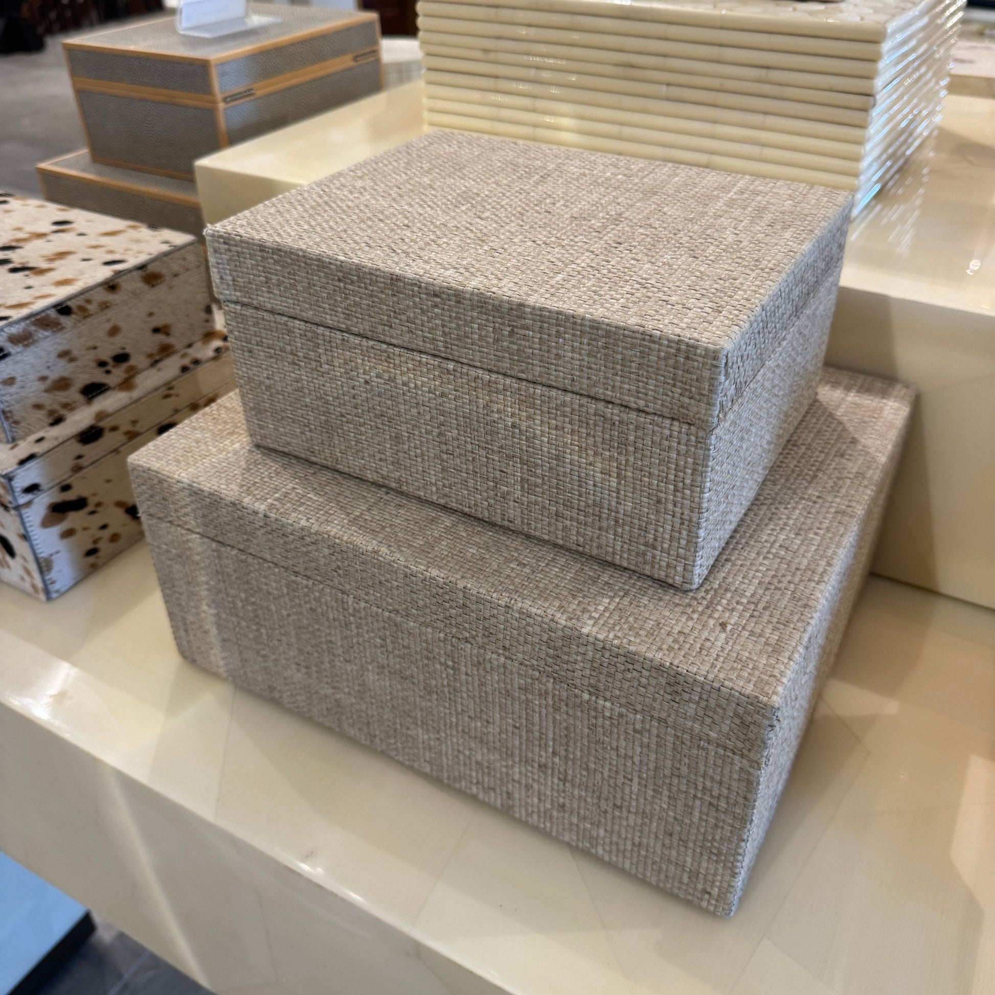 Stack of textured storage boxes on a counter