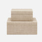 Two beige fabric boxes stacked on a white background