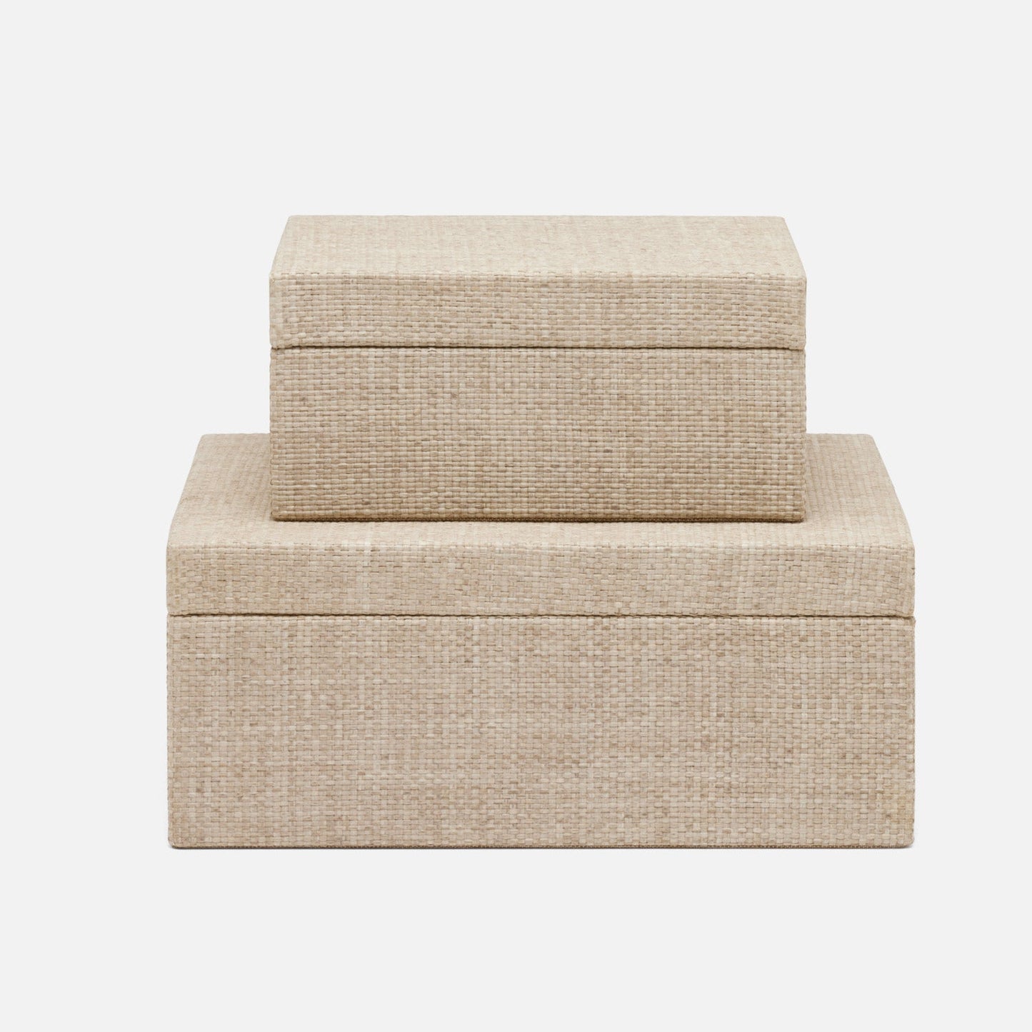 Two beige fabric boxes stacked on a white background