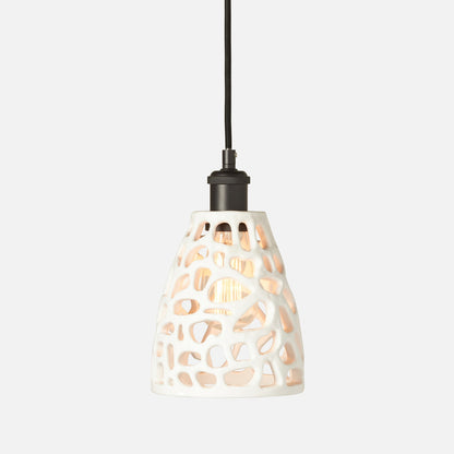 Pendant light with decorative white shade on a white background