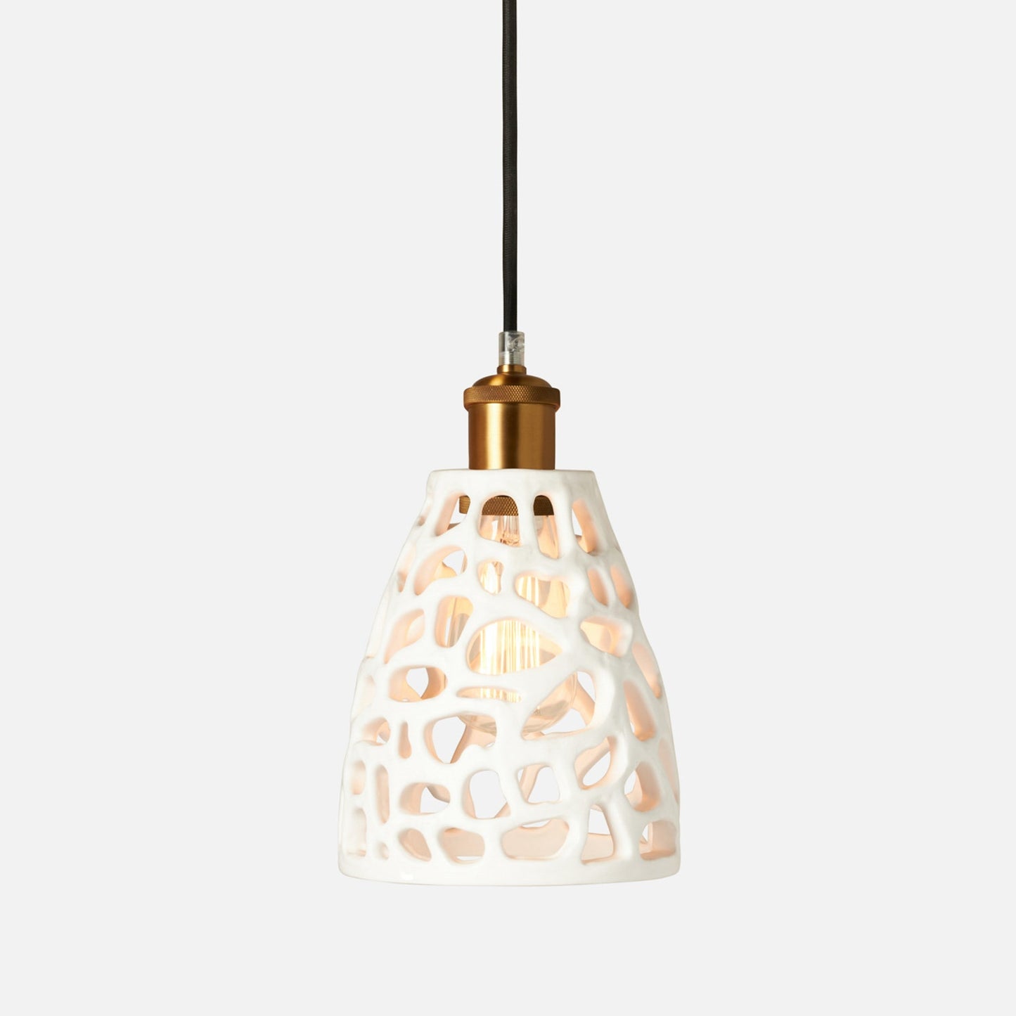 Pendant light with a decorative white shade on a white background