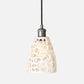 Pendant light with a decorative glass shade on a white background