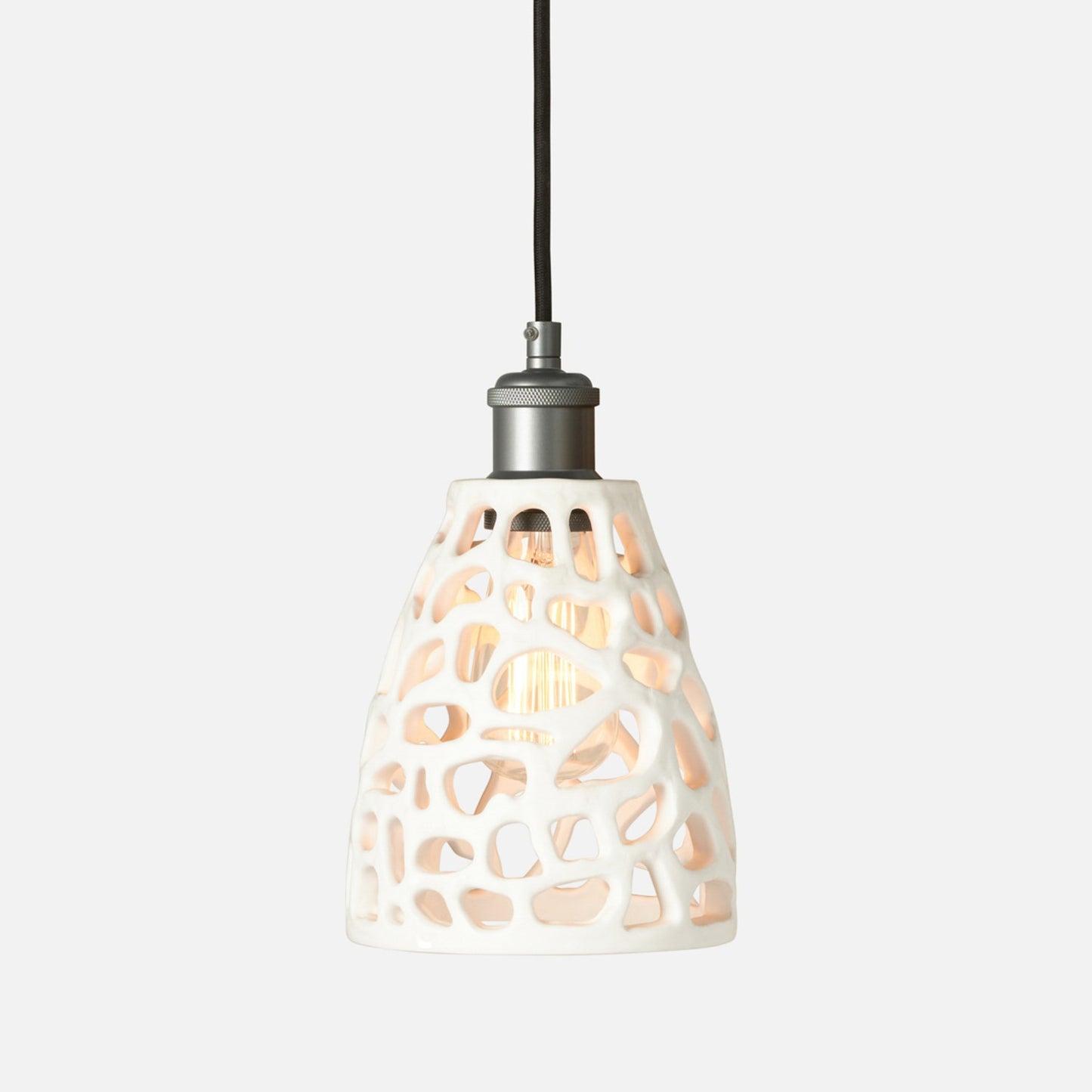 Pendant light with a decorative glass shade on a white background