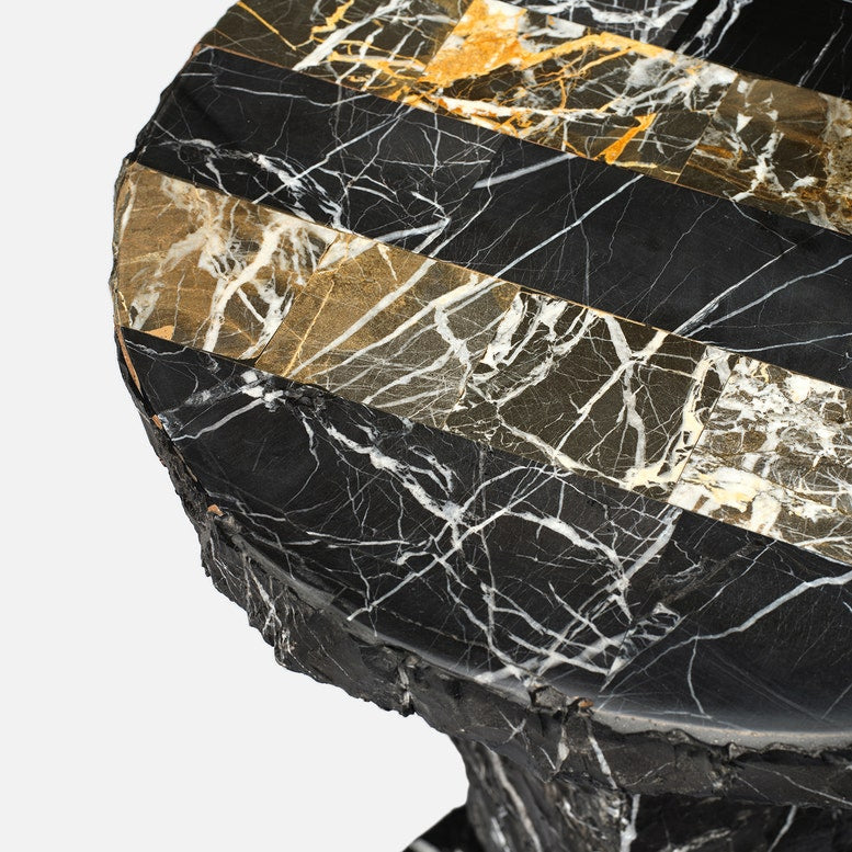 Marble-patterned surface with black, gold, and white colors on a white background