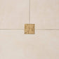 Beige tiles with a gold decorative square in the center