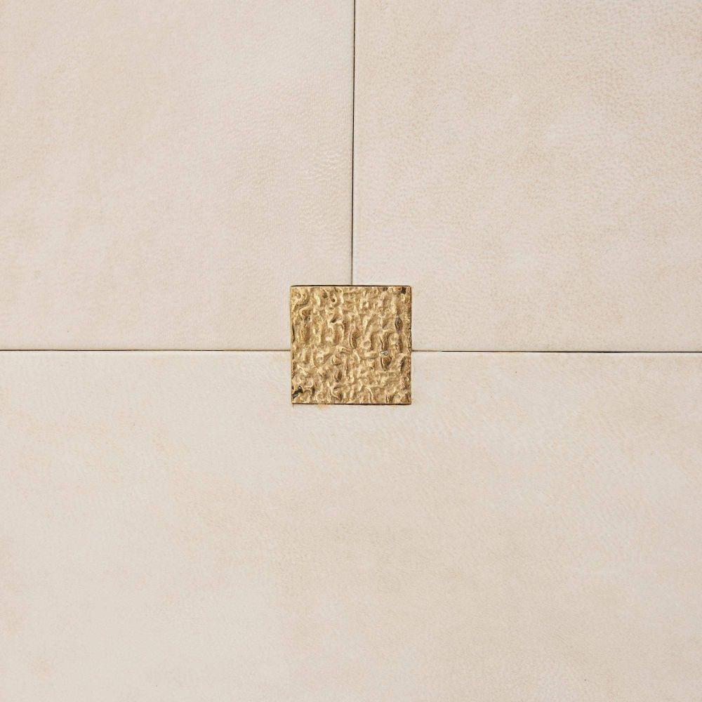 Beige tiles with a gold decorative square in the center