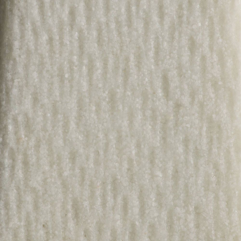 Close-up of a textured beige fabric surface