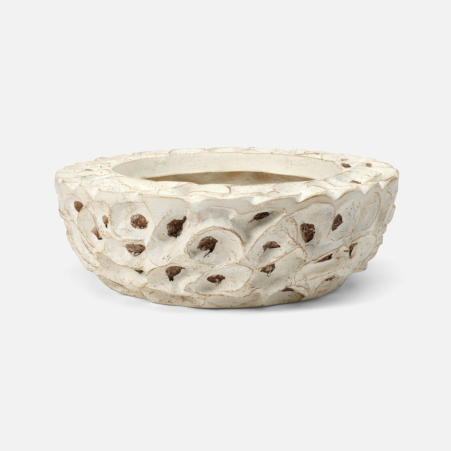 Decorative ceramic planter with textured surface on a white background