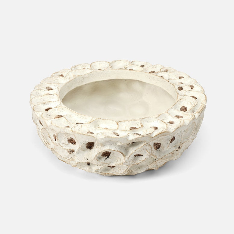Decorative silver bowl with textured surface on a white background