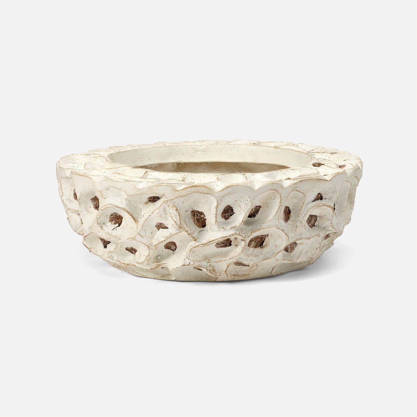 Decorative white ceramic planter with intricate cut-out design on a white background