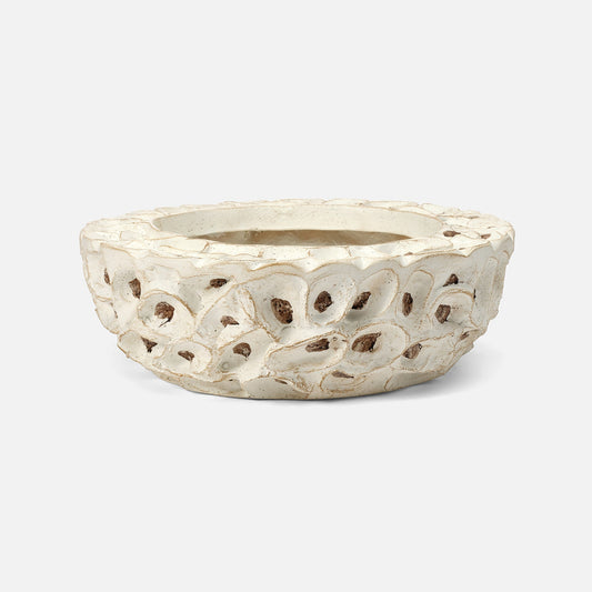 Decorative white ceramic planter with intricate cut-out design on a white background