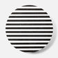 Round coaster with black and white striped pattern on a white background