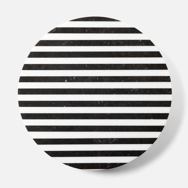 Round coaster with black and white striped pattern on a white background