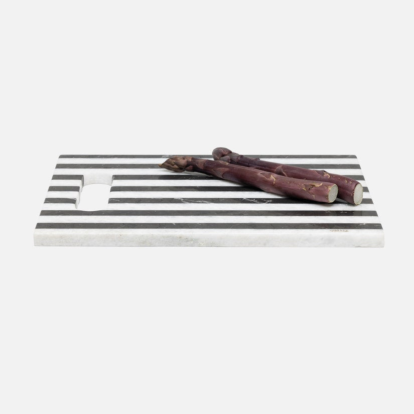 Black and white striped tray with two wooden sticks on a white background