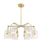 Modern chandelier with gold fixtures and clear glass shades on a white background