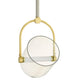 Pendant light with gold fixture and clear glass shade on a white background